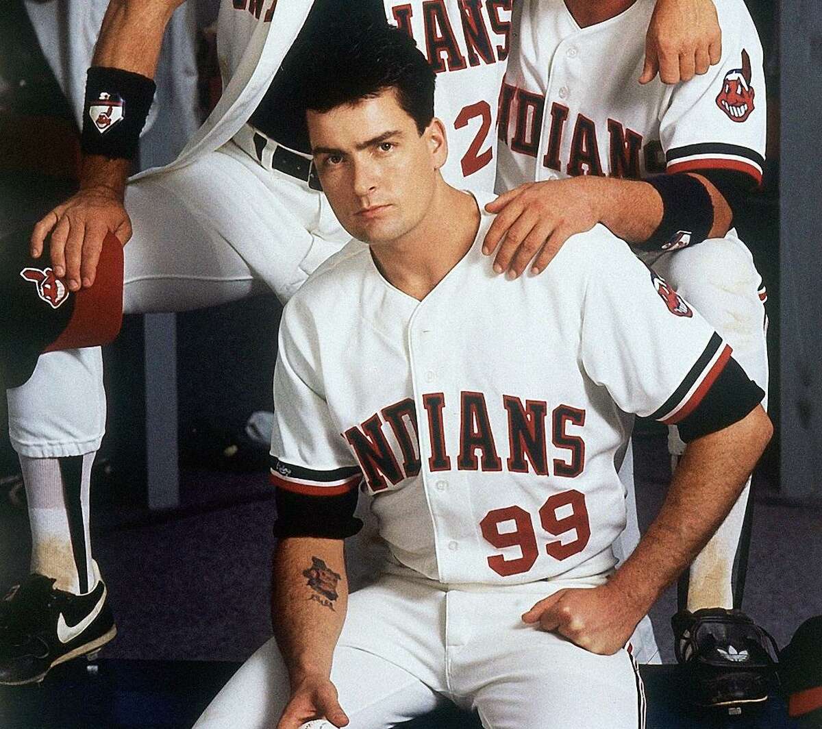 In this image provided by Paramount Pictures, Tom Berenger, right, plays Cleveland Indians catcher Jake Taylor, Charlie Sheen, below, is the team's pitcher Ackie Vaughn, and Corbin Bemsen, above, plays third baseman Rodger Dom in the Paramount comedy "Major League" in 1989. (AP Photo/Paramount Pictures, Timothy White) NO SALES