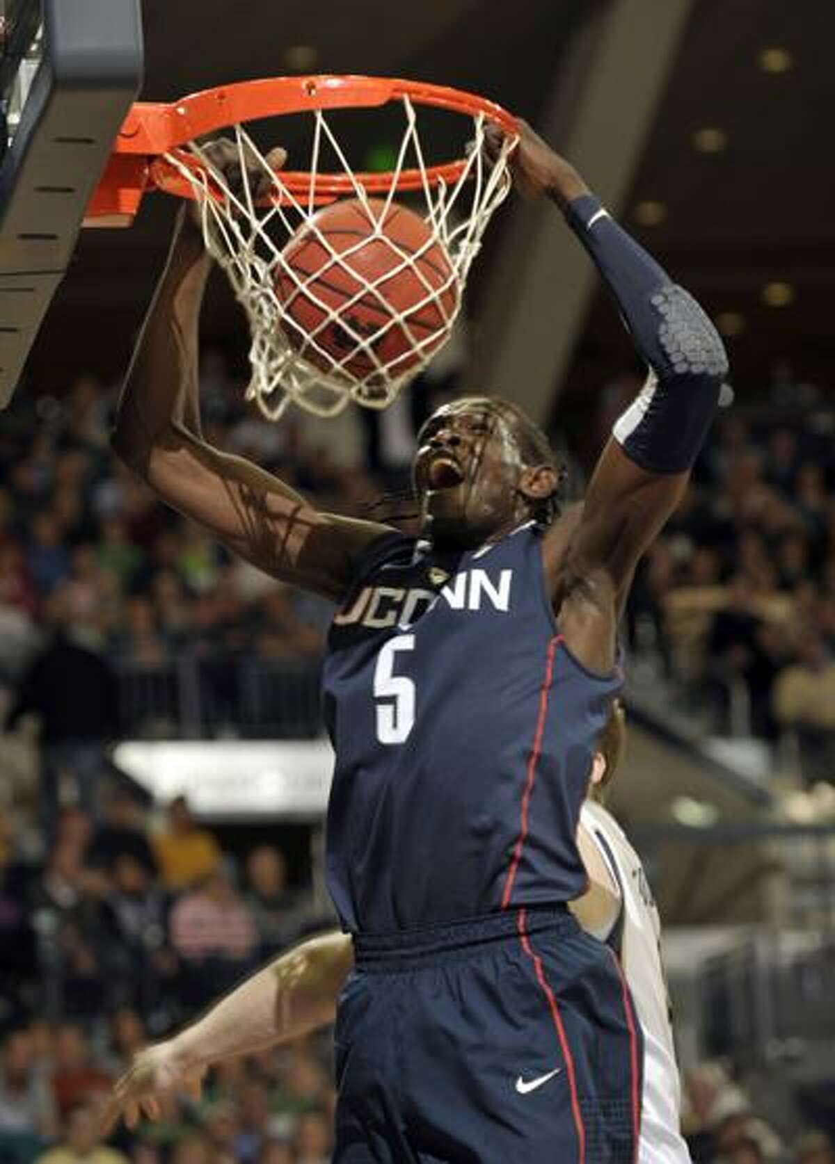 Connecticut forward Ater Majok dunks the ball in the first half of an NCAA college basketball game against Notre Dame Wednesday, March 3. (AP)