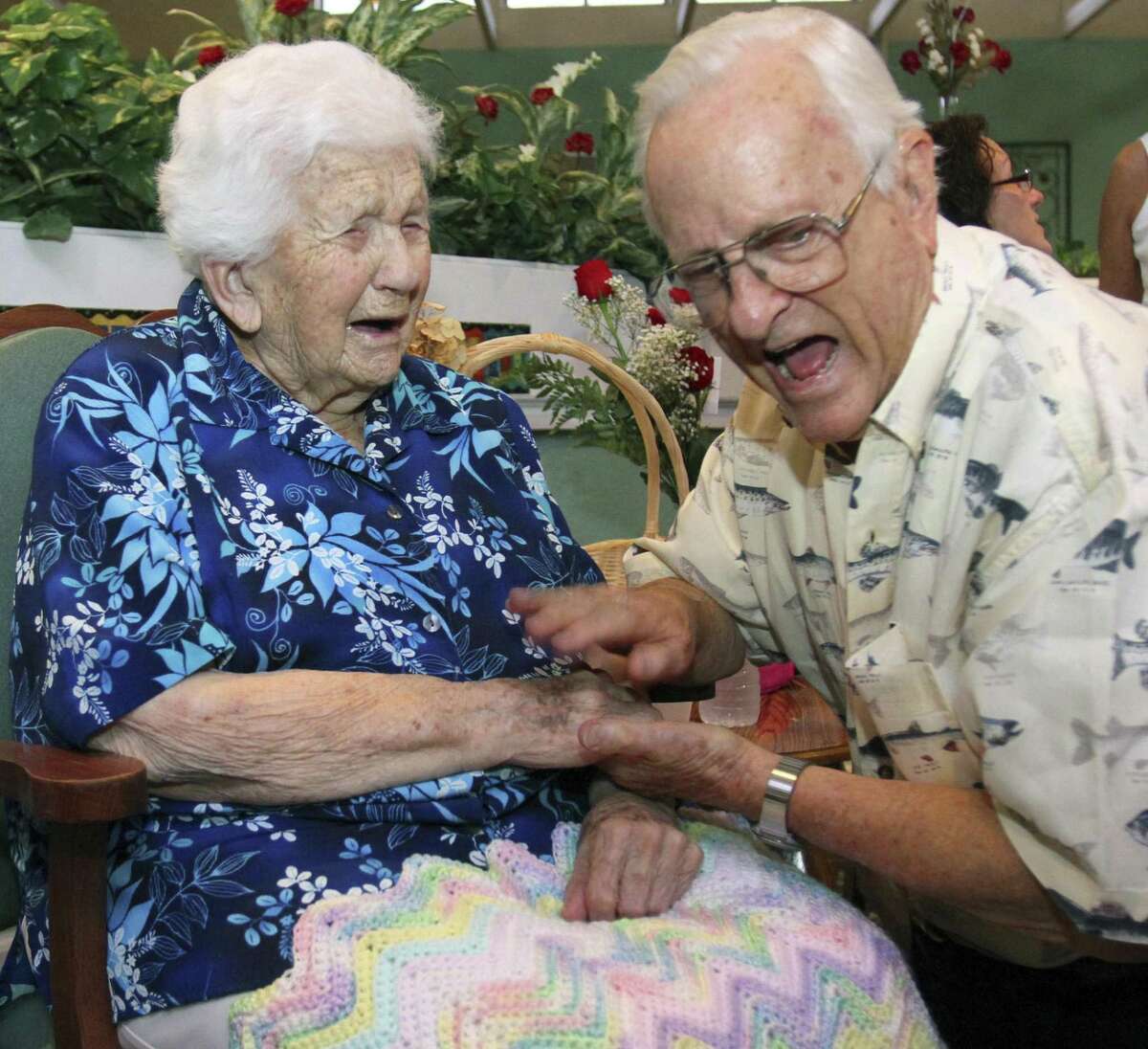In this Sept. 3, 2010 photo, Onie Ponder, left, laughs with her nephew Dick Chazal during her 112th birthday party at Emeritus at Ocala East in Ocala, Fla. Onie Ponder died early Friday, Dec. 31, 2010. According to the Gerontology Research Group, Ponder had been the oldest person in Florida and one of the 25 oldest people in the world. (AP Photo/Ocala Star-Banner, Bruce Ackerman)