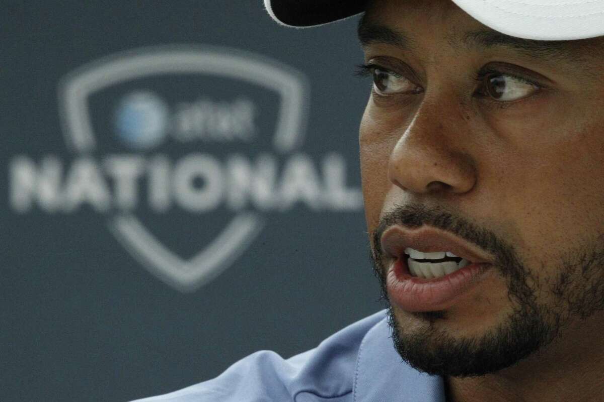 Tiger Woods makes remarks during a news conference at the AT&T National golf tournament at the Aronimink Golf Club Tuesday, June 28, 2011, in Newtown Square, Pa. Woods says he's done playing with pain. Woods says he is making progress in his recovery from injuries to his left leg, although he has no idea when he will return to golf. He says he has played with injuries too much in his career, and now is the time to be smarter about his health. (AP Photo/Matt Rourke)