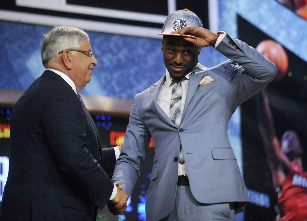NBA Commissioner David Stern, left, poses with Connecticut's Kemba Walker, whom the Charlotte Bobcats selected with the ninth pick in the NBA basketball draft Thursday, June, 23, 2011, in Newark, N.J. (AP Photo/Bill Kostroun)
