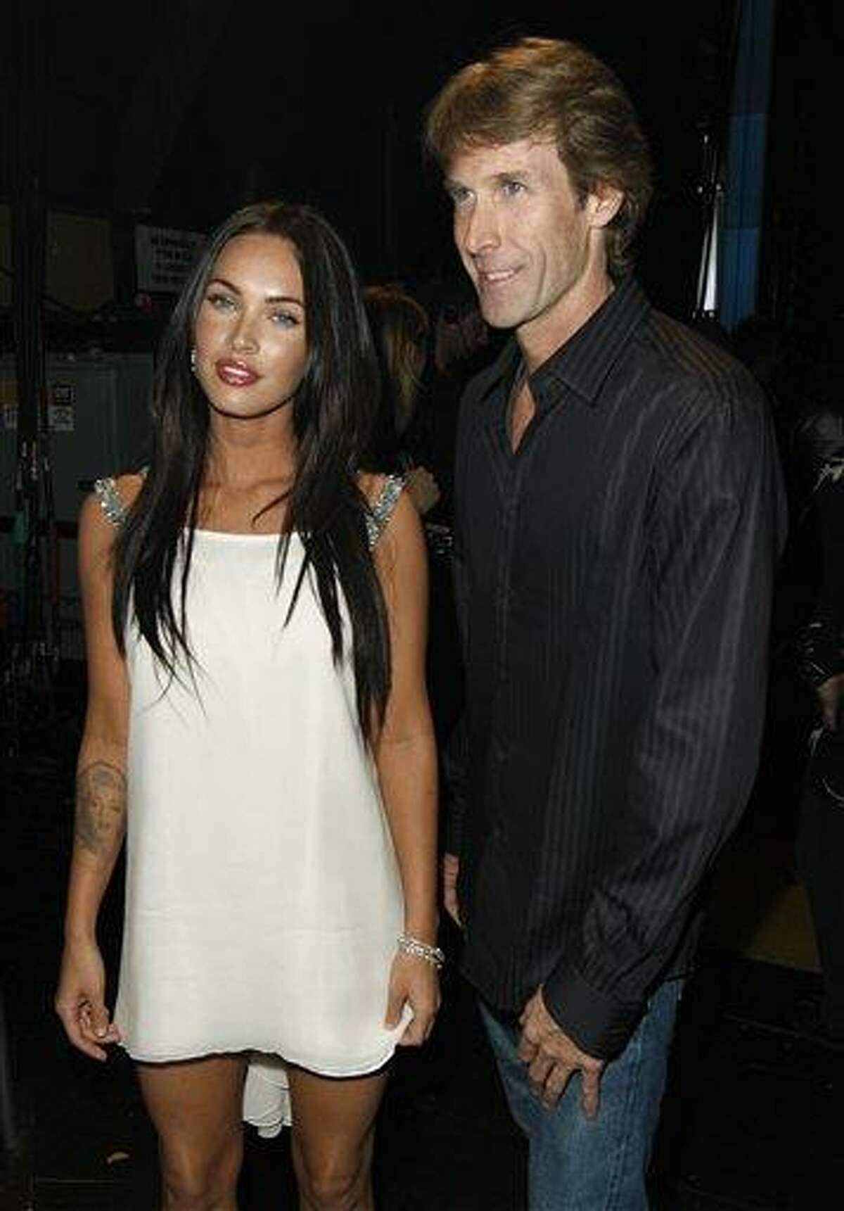 In this June 1, 2008 file photo, actress Megan Fox, left, and director Michael Bay pose together at the MTV Movie Awards in Los Angeles. Bay directed Fox in the films "Transformers," and "Transformers: Revenge of the Fallen." (AP Photo/Matt Sayles, file)