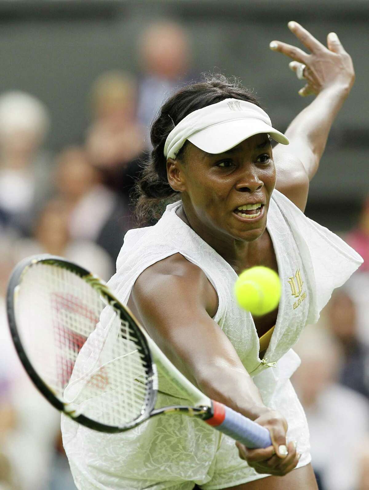 Venus Williams of the US in action during the match against Japan's Kimiko Date-Krumm at the All England Lawn Tennis Championships at Wimbledon, Wednesday, June 22, 2011. (AP Photo/Kirsty Wigglesworth)