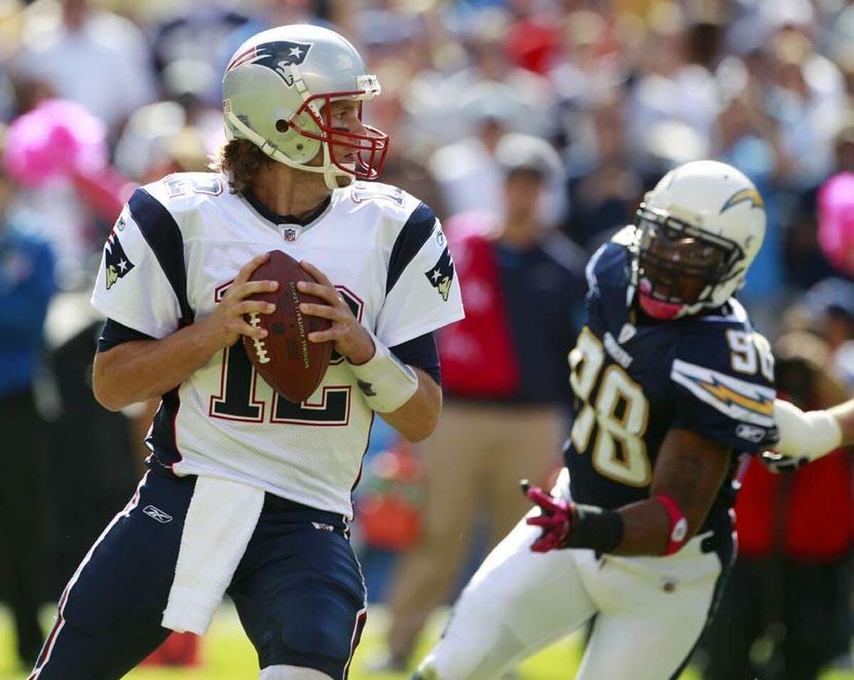 New England Patriots quarterback Tom Brady looks to pass against the San Diego Chargers in the first half during an NFL football game Sunday in San Diego. (AP Photo/Lenny Ignelzi)