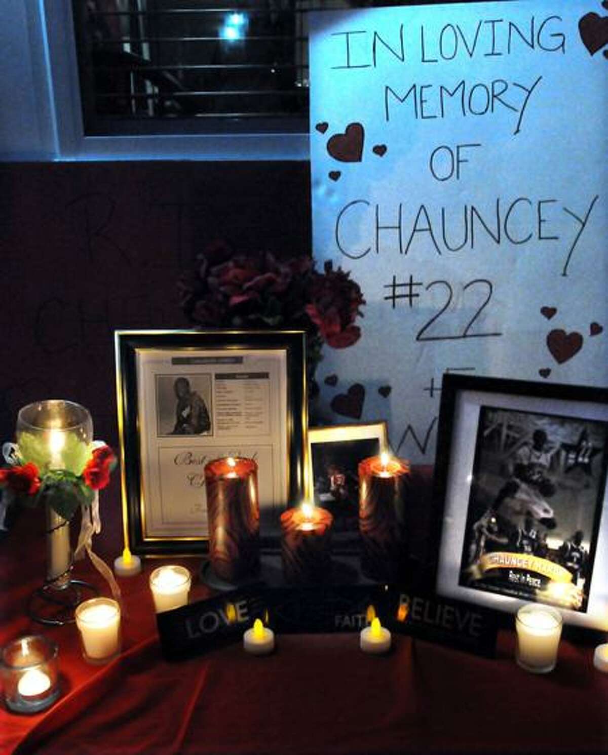 The family and friends of Chauncey Hardy near his childhood home in Middletown to call attention to the questions surrounding his death in Romania. A makeshift memorial by the back door of Chauncey's aunt's house. Photo by Mara Lavitt/New Haven Register10/15/11