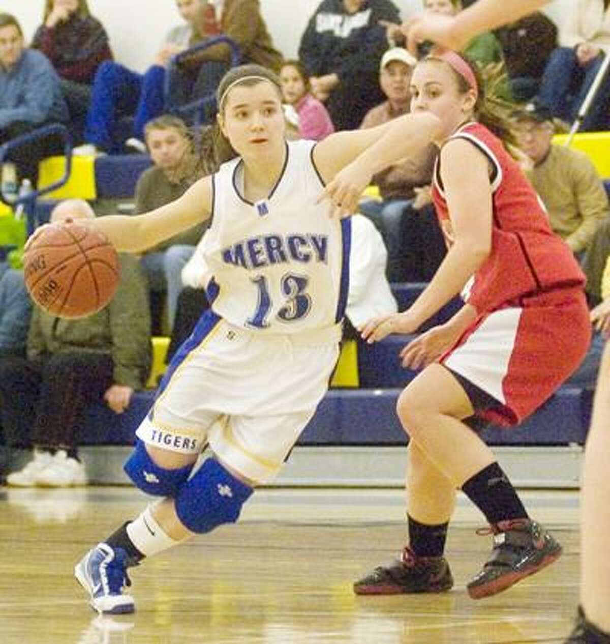 Mercy's Maria Wesleyj drives to the basket Wednesday against Cheshire at Mercy High School. (Max Steinmetz / Special to the Press)