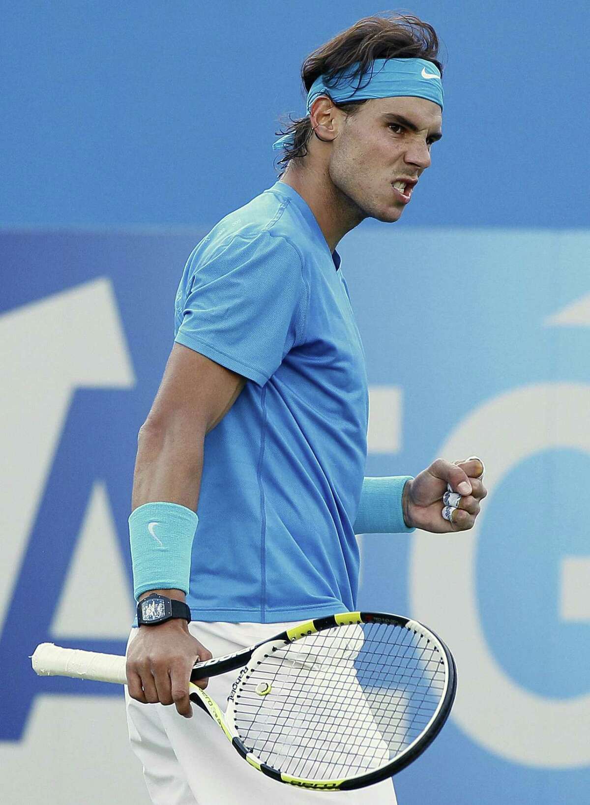 Rafael Nadal of Spain reacts after playing a return to Radek Stepanek of Czech Republic during their singles tennis match at the Queen's Grass Court Championship in London, Thursday, June 9, 2011. (AP Photo/Kirsty Wigglesworth)