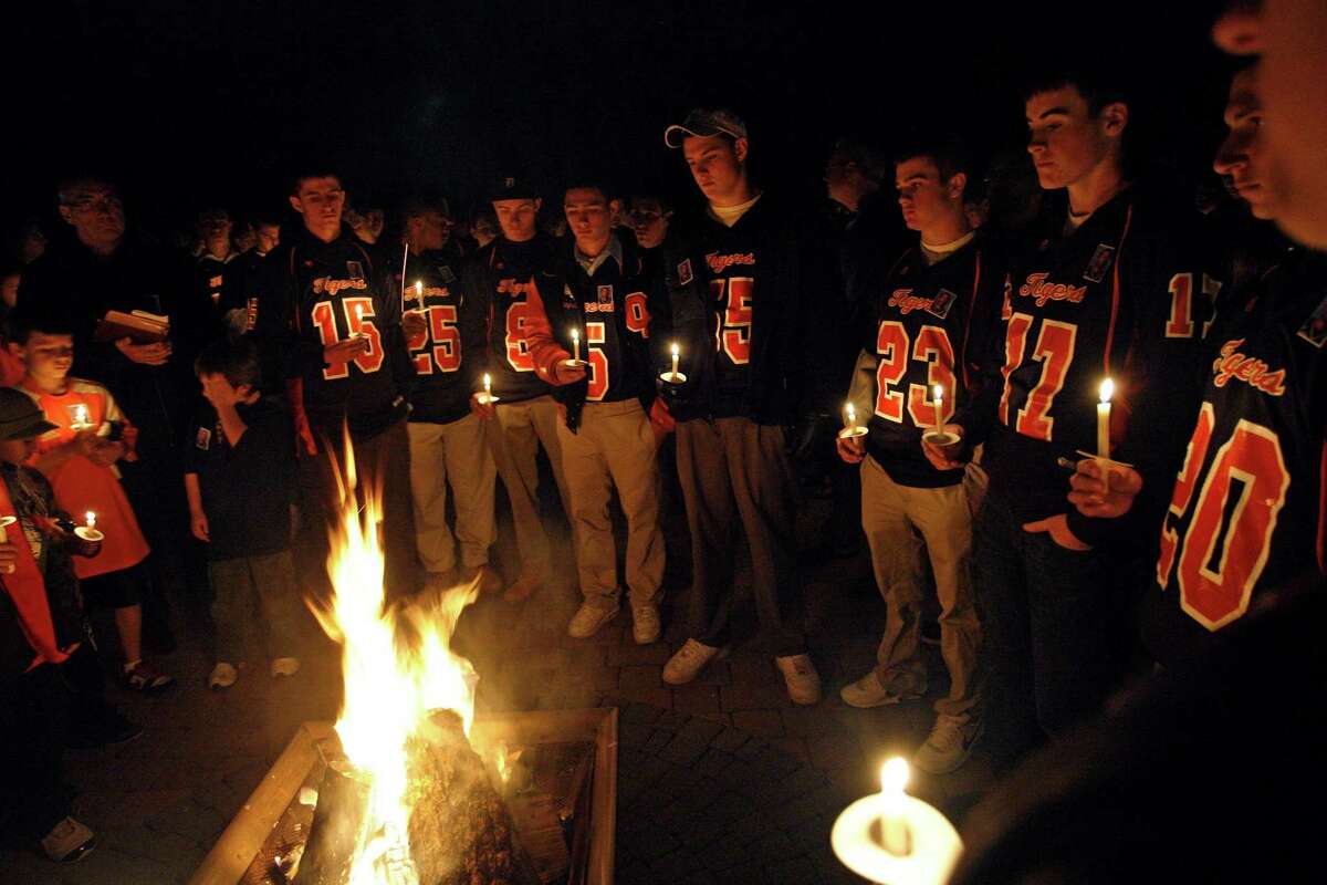 Members of the Oliver Ames High School in Easton, Mass. attend a vigil for Danroy Henry, Jr., a football player at Pace University, Monday, Oct. 18, 2010, in Easton, Mass.. Henry of Easton, Mass., was killed hours after playing in Pace University's homecoming game, after a disturbance at a bar in Thornwood, N.Y., spilled into the parking lot where he was fatally shot by the police. (AP Photo/Stew Milne)