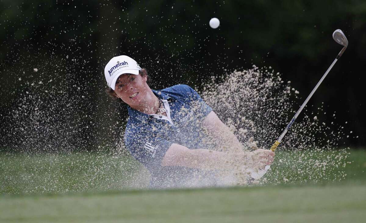 Rory McIlroy, of Northern Ireland, chips out of a bunker to the 14th green during the first round of the U.S. Open Championship golf tournament in Bethesda, Md., Thursday, June 16, 2011. (AP Photo/Matt Slocum)