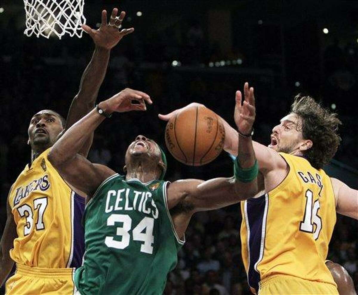 Los Angeles Lakers forward Pau Gasol, right, of Spain, blocks a shot by Boston Celtics forward Paul Pierce as Lakers' Ron Artest defends during the second half of Game 7 of the NBA basketball finals Thursday, June 17, 2010, in Los Angeles. The Lakers won 83-79 to take the title. (AP Photo/Jae C. Hong)