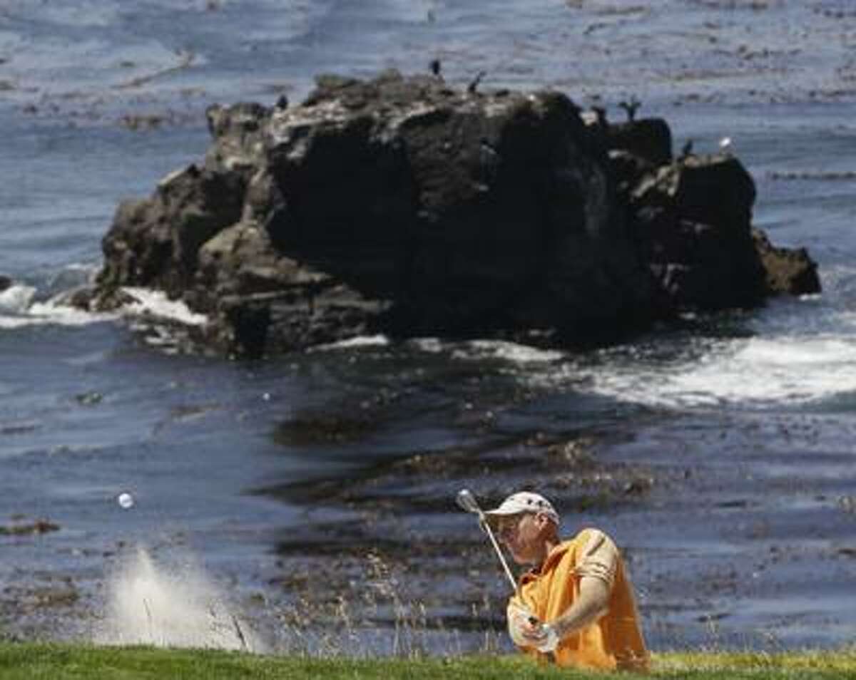 Jim Furyk hits out of a bunker on the eighth hole during a practice round for the U.S. Open golf tournament Wednesday. (AP)