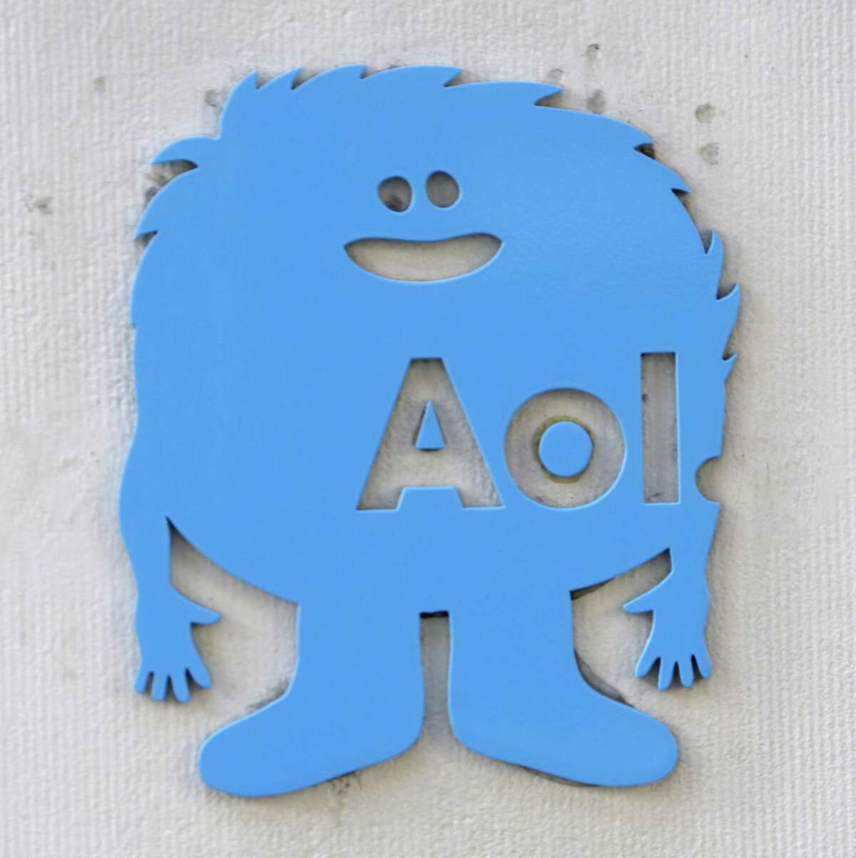 A small AOL placard is displayed on their offices in New York, Monday. Internet company AOL Inc. is buying news hub Huffington Post in a $315 million deal that represents a bold bet on the future of online news. (AP Photo/Seth Wenig)