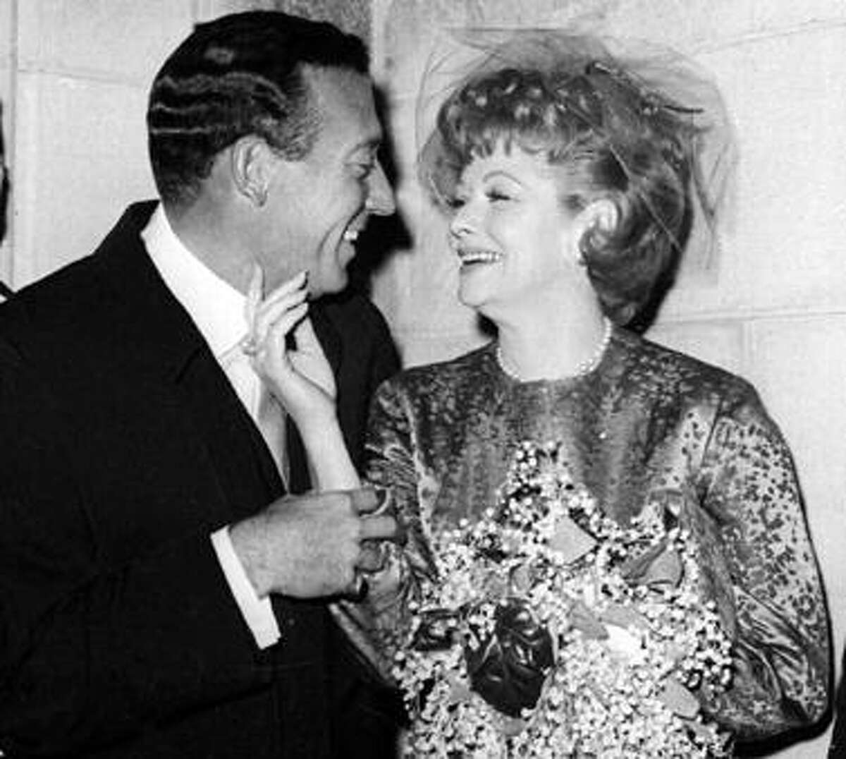 FILE - In this Nov. 20, 1961 file photo, Gary Morton, left, and Lucille Ball pose after their wedding at the Marble Collegiate Church in New York. (AP Photo, file)