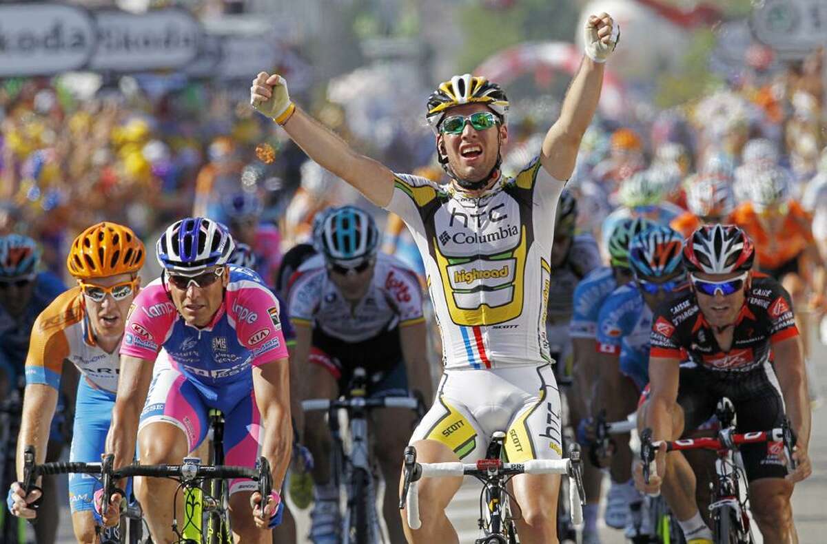 Mark Cavendish of Britain crosses the finish line to win the 11th stage of the Tour de France cycling race over 184.5 kilometers (114.6 miles) with start in Sisteron and finish in Bourg-les-Valences, France, Thursday, ahead of Tyler Farrar of the U.S., far left, Alessandro Petacchi of Italy, second left, and Jose Joaquin Rojas of Spain, far right. (AP Photo/Laurent Rebours)