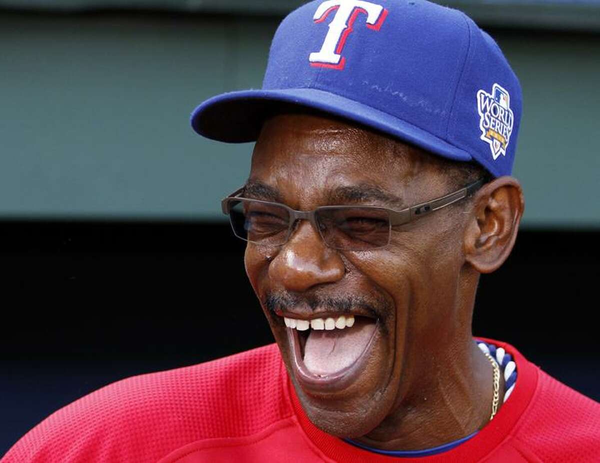 Texas Rangers manager Ron Washington, front right, greets Adrian