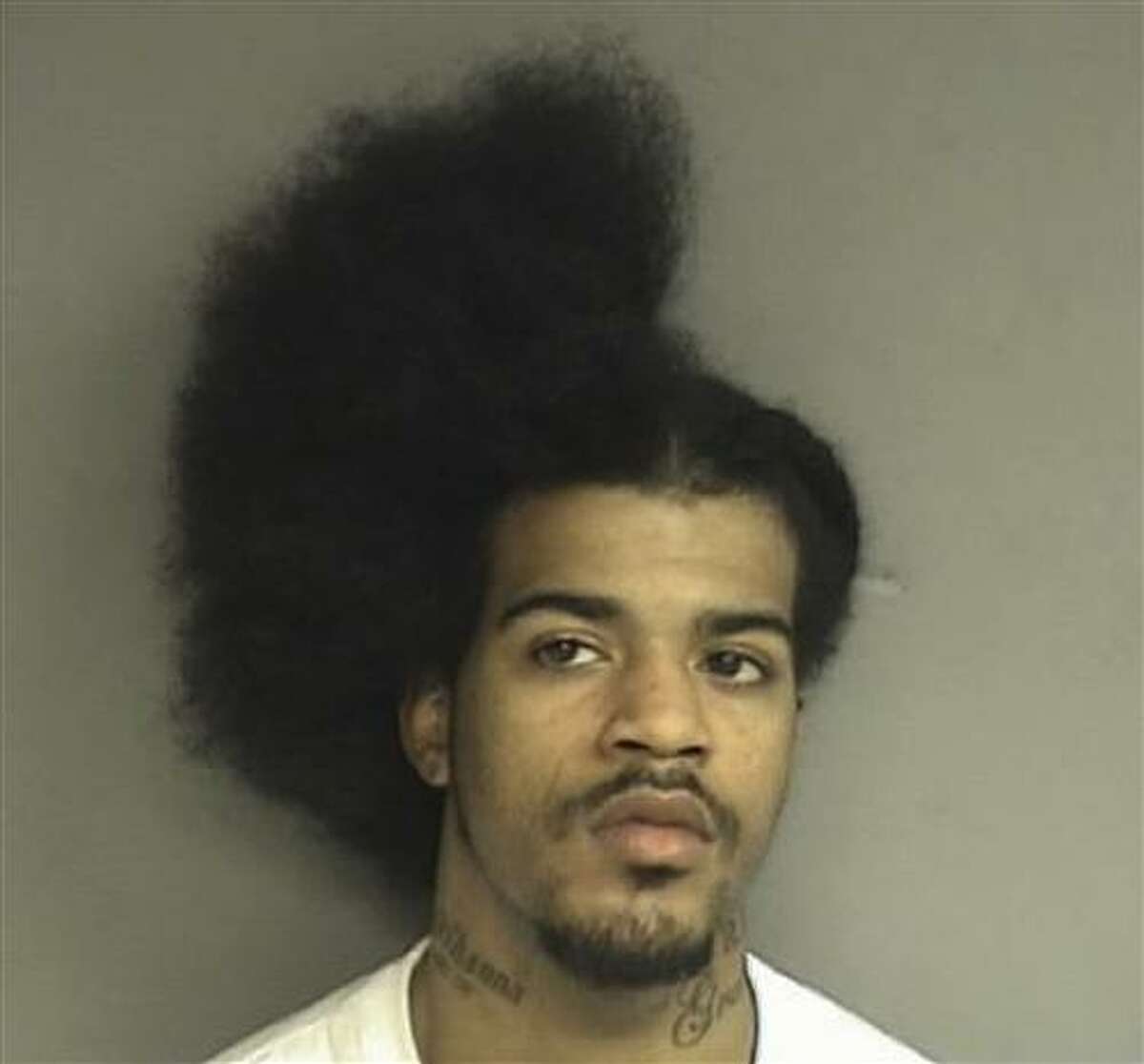 This Tuesday, March 8, 2011 booking photo released by the Stamford, Conn., Police shows David C. Davis, 21, of New Haven, Conn., who was arrested Tuesday and charged with slashing another man in the back while he was in the middle of a haircut. (AP Photo/Stamford Police Department)