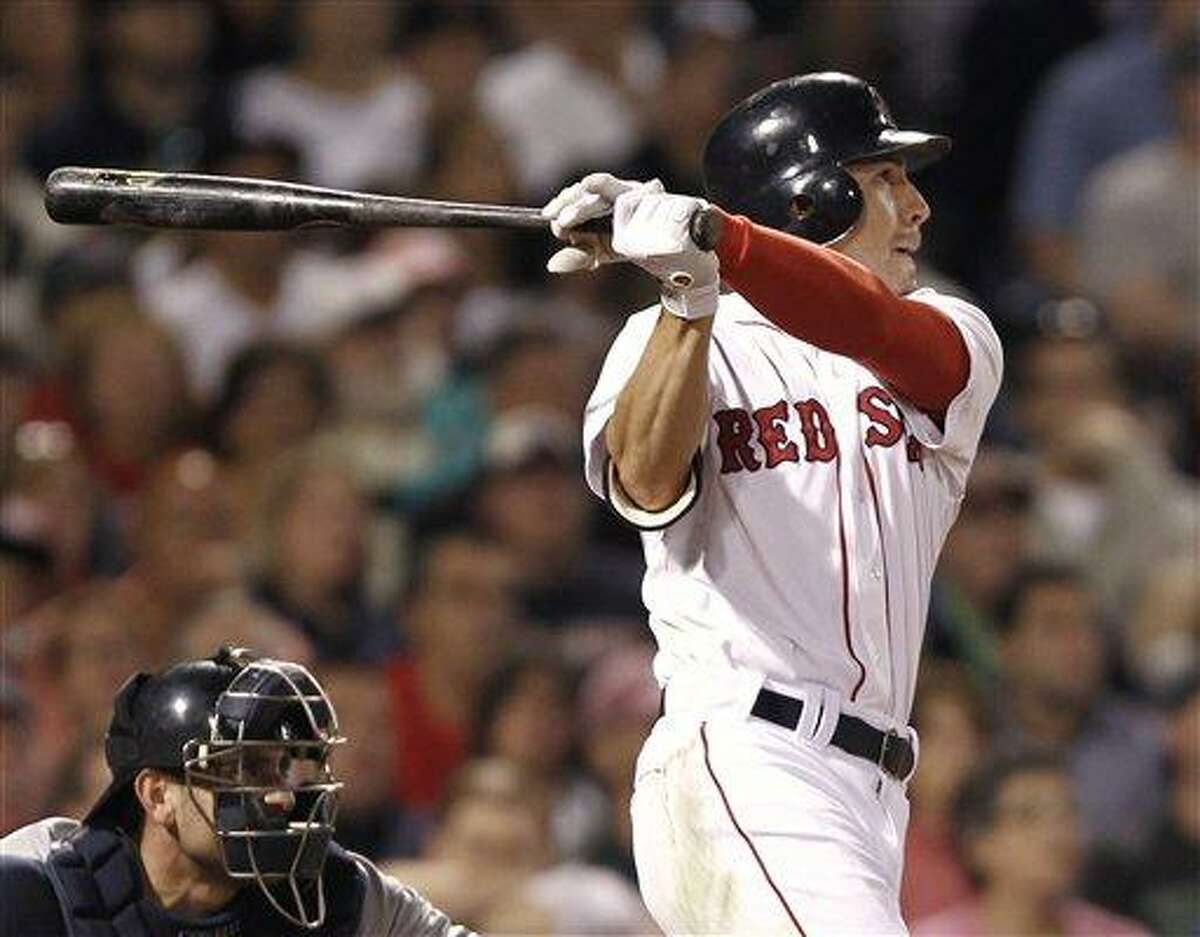 Boston Red Sox's Jacoby Ellsbury follows through on his two-run home run against the New York Yankees during the sixth inning of a baseball game at Fenway Park in Boston on Wednesday, Aug. 31, 2011. (AP Photo/Winslow Townson)