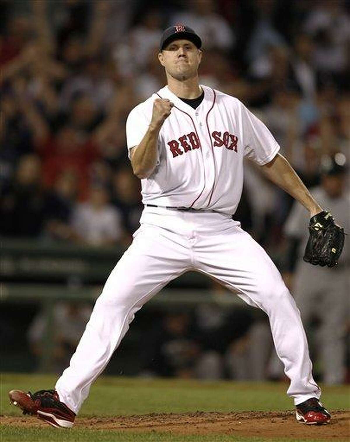 Boston Red Sox relief pitcher Jonathan Papelbon pumps his fist after striking out New York Yankees' Brett Gardner to end the baseball game at Fenway Park in Boston Wednesday, Aug. 31, 2011. Boston won 9-5. (AP Photo/Winslow Townson)