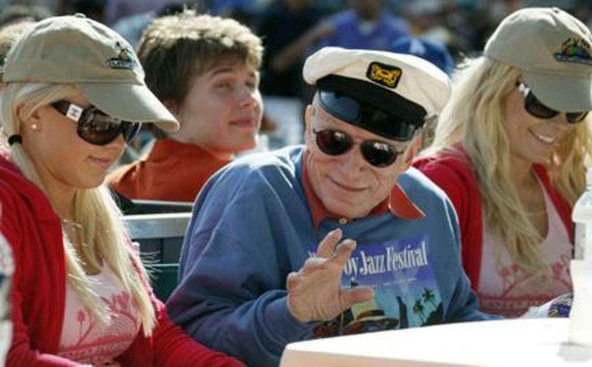 Hugh Hefner waves from his front row center box at the 32nd annual Playboy Jazz Festival at the Hollywood Bowl in Los Angeles Saturday, June 12, 2010. (AP Photo/Reed Saxon)