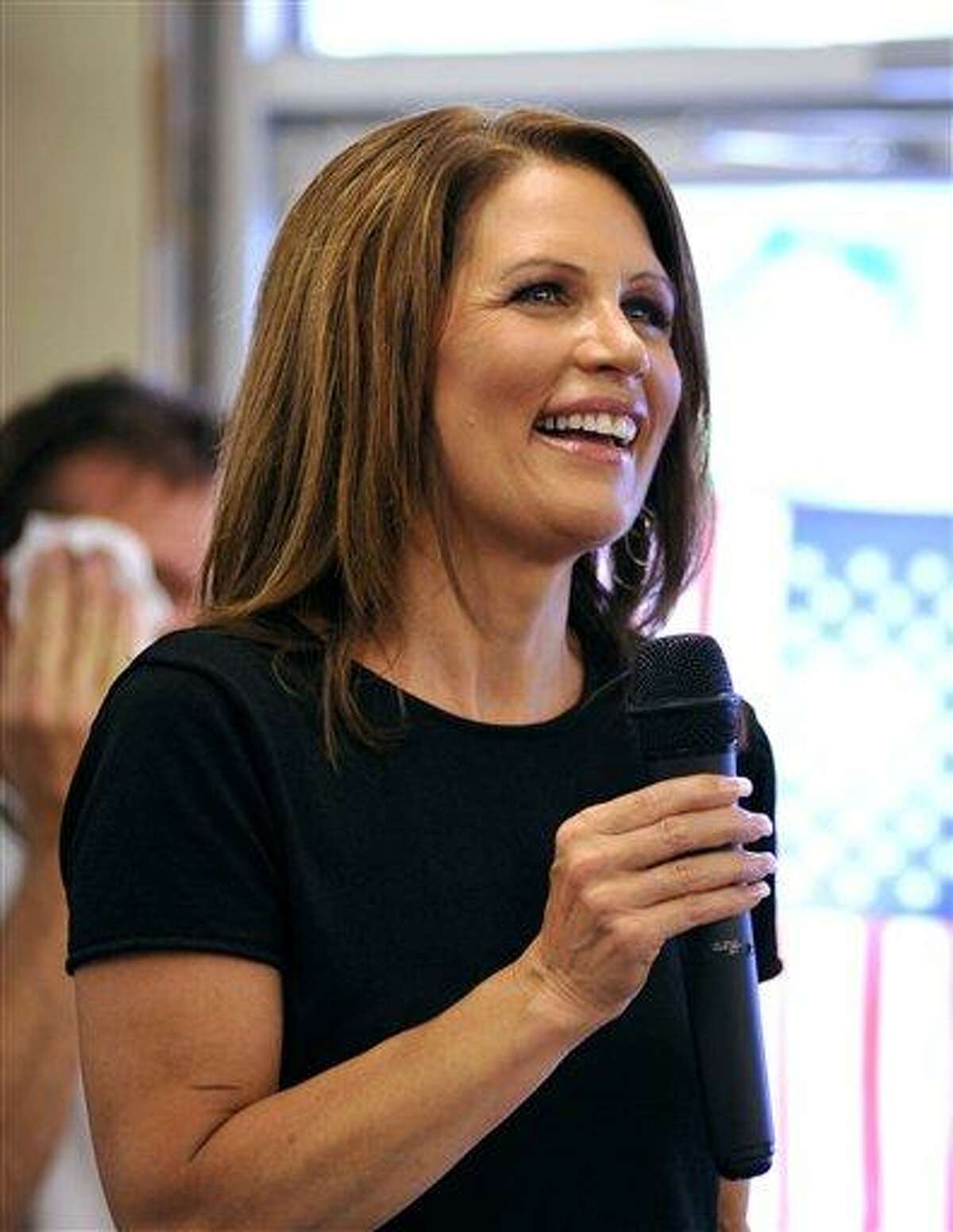 In this Aug. 26, 2011 file photo, Presidential candidate U.S. Rep. Michele Bachmann, R-Minn., speaks to supporters during a campaign stop at Angie's Subs, in Jacksonville Beach, Fla. Sentinel, a conservative imprint of Penguin Group (USA), announced Monday, Aug. 29, that the Bachmann's memoir will arrive in November and already has been completed. The book, reports of which first circulated in June, is currently untitled. (AP Photo/Rick Wilson, file)
