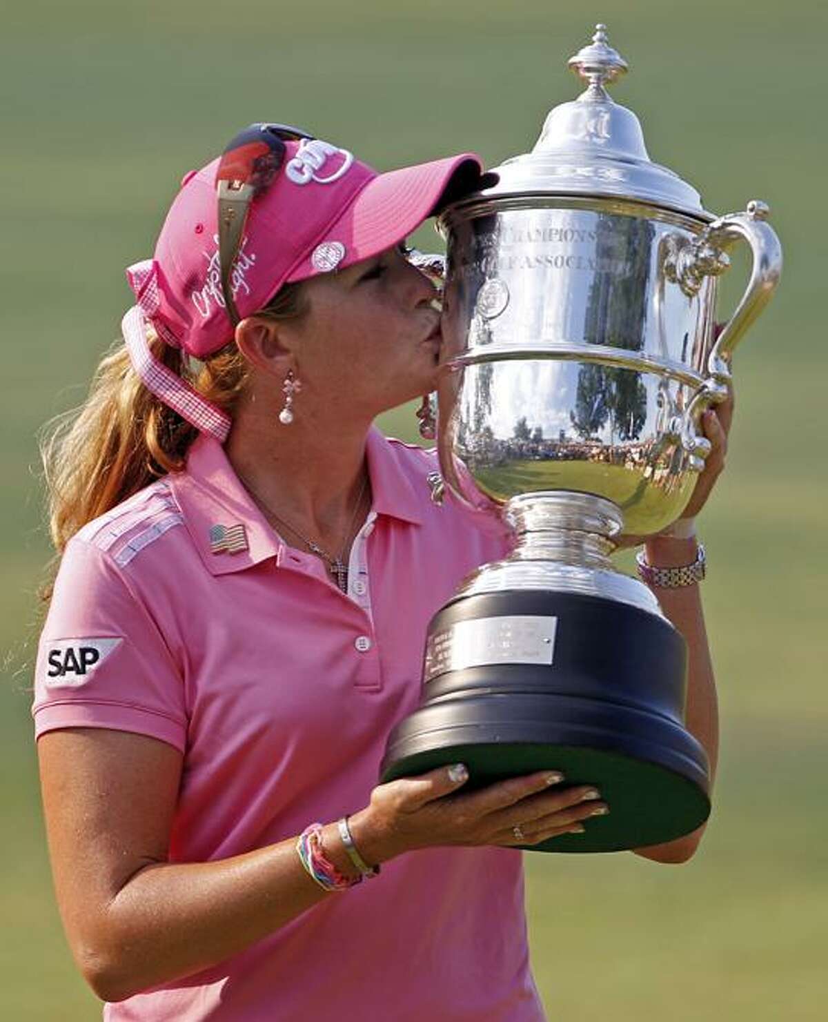 Paula Creamer kisses the trophy after winning the U.S. Women's Open golf tournament at Oakmont Country Club in Oakmont, Pa., Sunday. Creamer has won her first major after a final-round, 2-under 69 gave her a 3-under 281 for the tournament. (AP Photo/Gene J. Puskar)