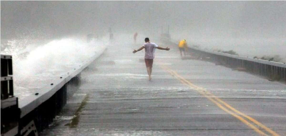 Hurricane Irene. Thrill seekers on the causeway between Old Saybrook and Fenwick Point. Photo by Mara Lavitt/New Haven Register