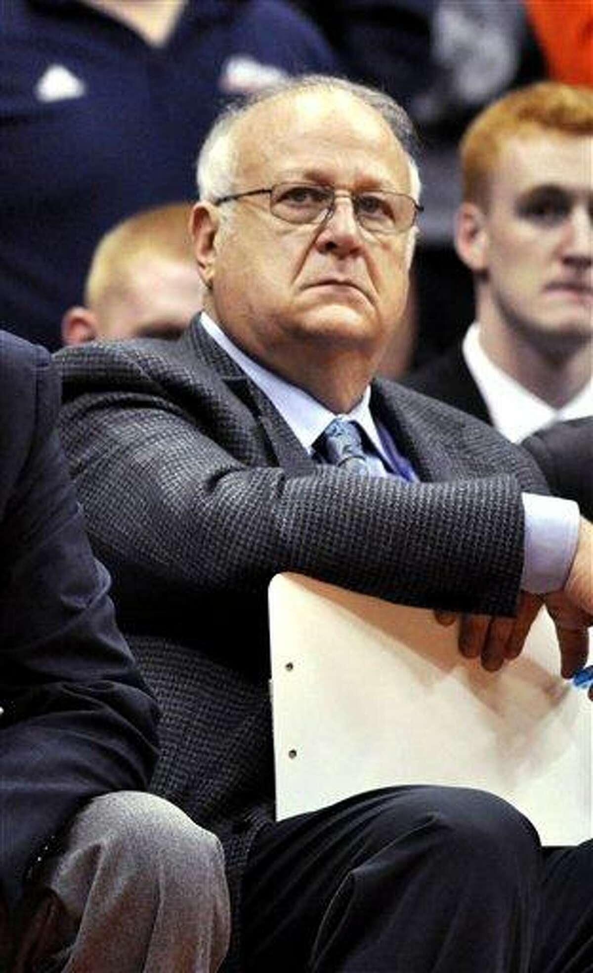 This file photo from Nov. 14 shows Syracuse basketball assistant coach Bernie Fine watching a college basketball game against Manhattan in the NIT Season Tip-Off in Syracuse, N.Y. Associated Press