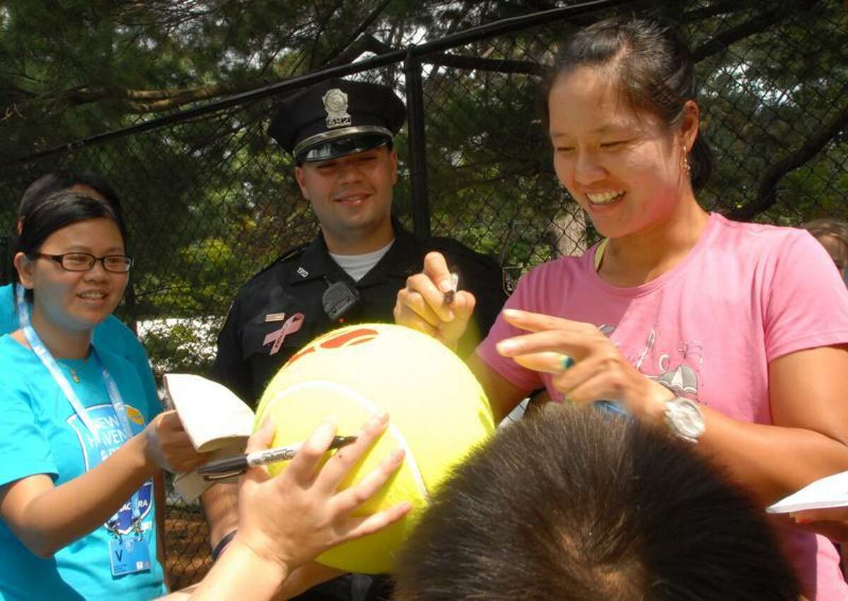 Li Na, the second seed as a Wild Card in the WTA New Haven Open, signs autographs for fans Sunday 8/21/11 at the Connecticut Tennis Center in New Haven. Photo by Peter Hvizdak / New Haven Register August 21, 2011 ph2346 Connecticut