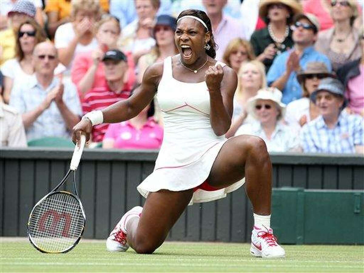 Serena Williams of the United States celebrates a point win over Russia's Vera Zvonareva during their women's singles final at the All England Lawn Tennis Championships at Wimbledon, Saturday. (AP)