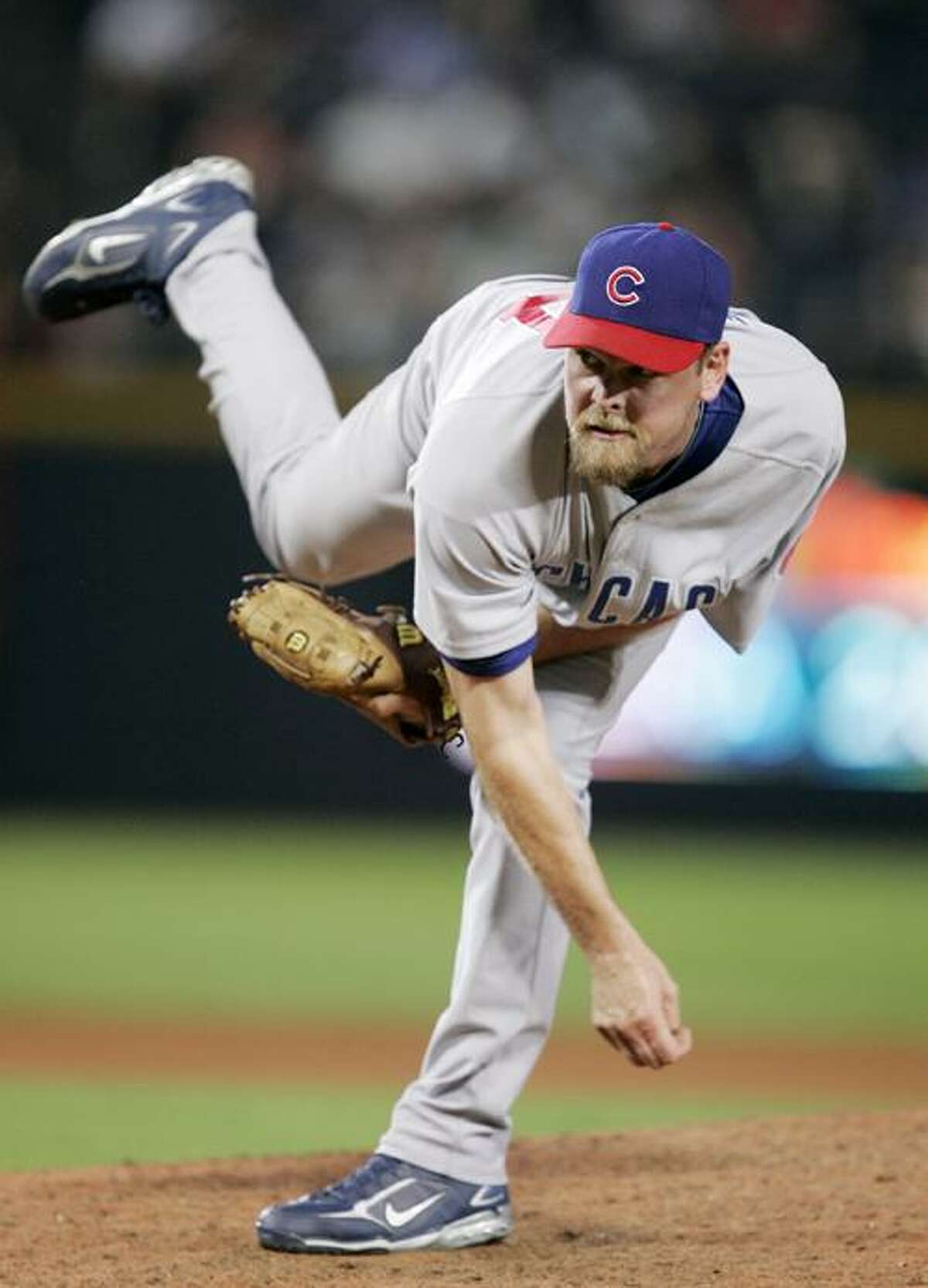 FILE - In this Aug. 13, 2008 file photo, Chicago Cubs pitcher Kerry Wood throws against the Atlanta Braves in the eighth inning of a baseball game in Atlanta. Wood is returning to the Chicago Cubs, agreeing to a one-year, $1.5 million contract, a person familiar with the negotiations told The Associated Press. The person spoke Thursday, Dec. 16, 2010, on condition of anonymity because the agreement had not yet been announced. (AP Photo/John Bazemore, File)