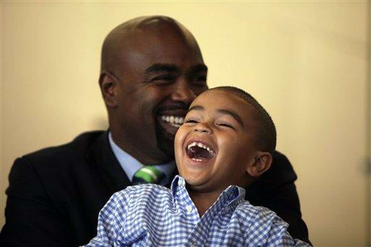 New York Mets first baseman Carlos Delgado, right, smiles after he