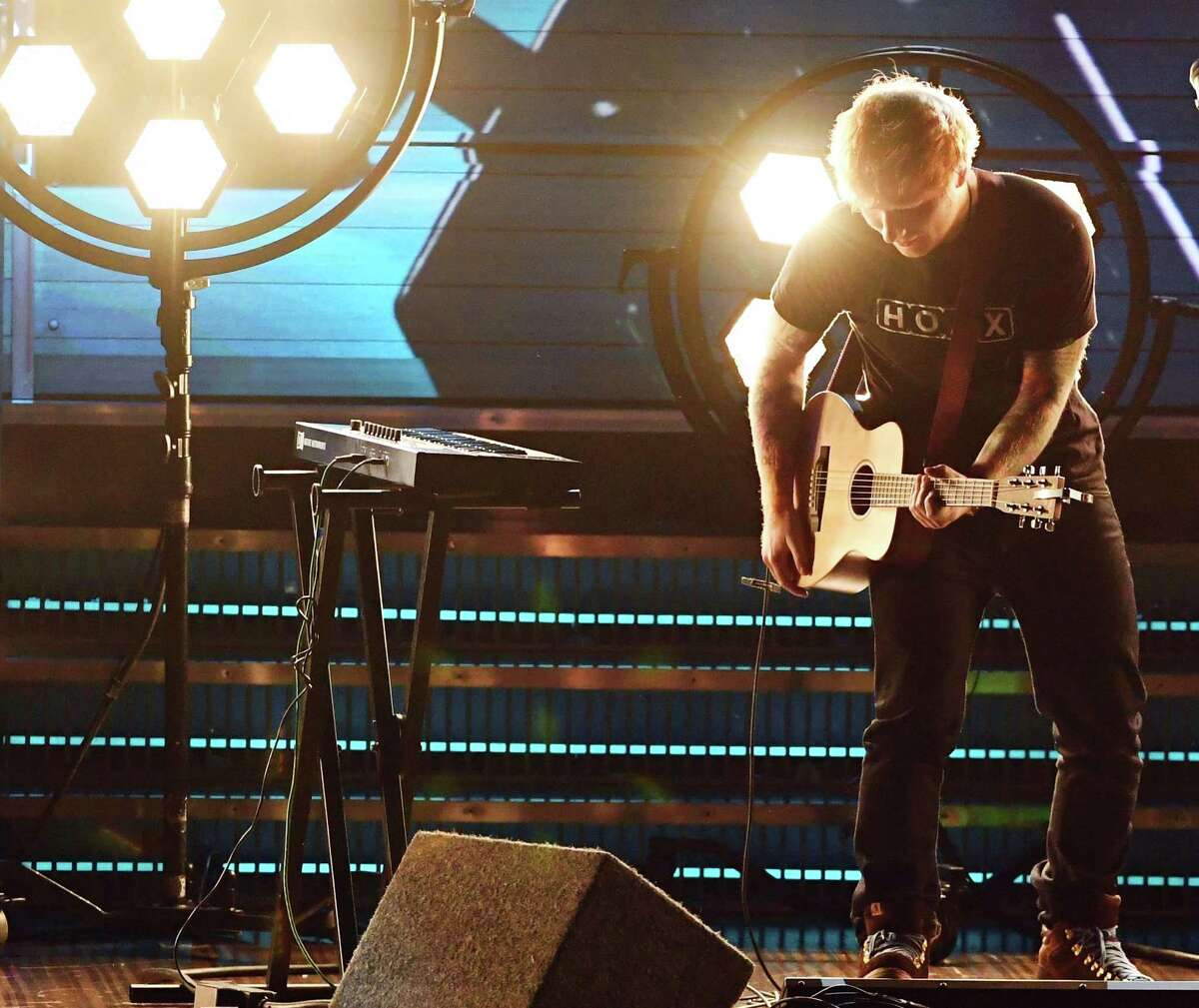 He performs alone Though he’s touring arenas, Ed Sheeran continues to perform without a band.