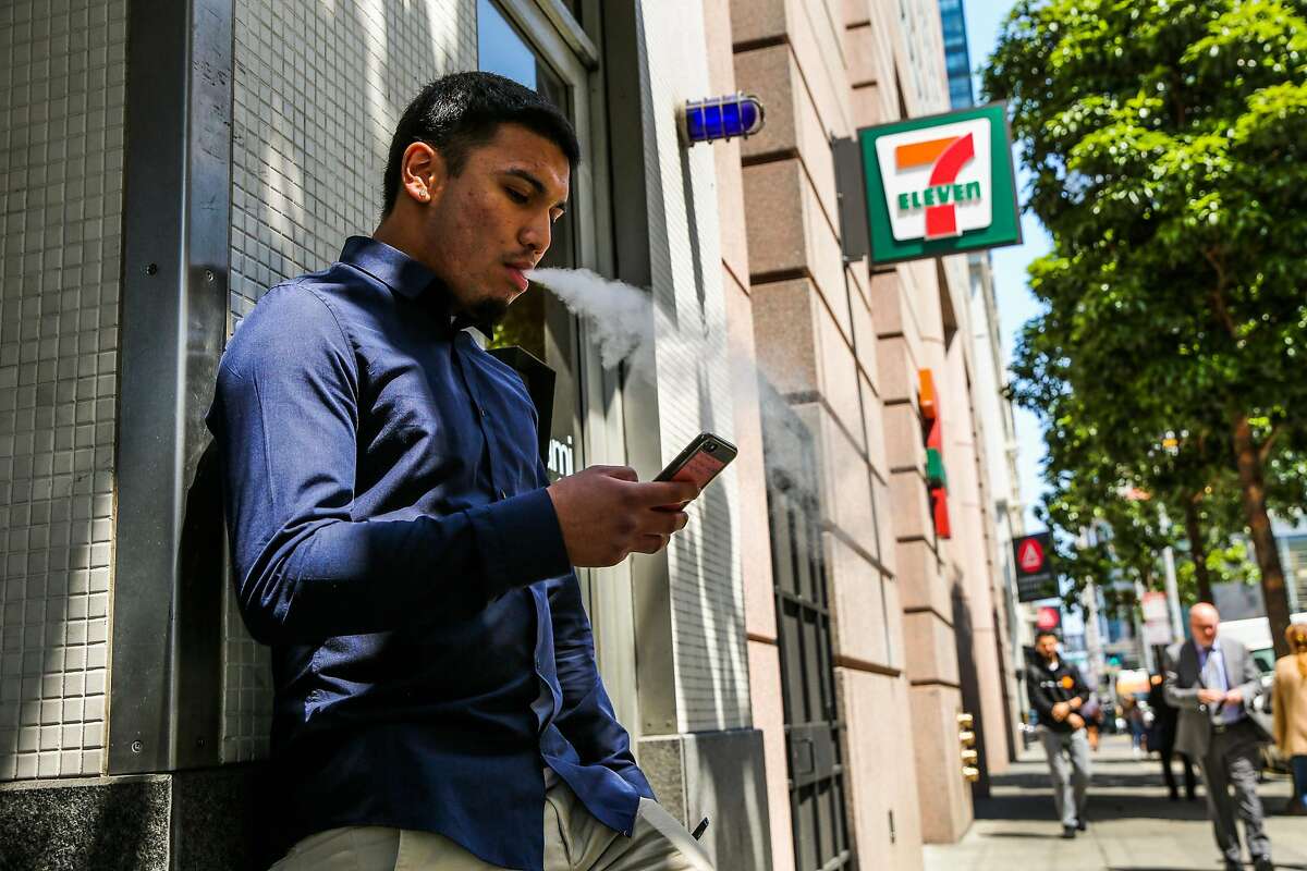 Mark Armendarez smokes outside 7-Eleven on Mission Street in San Francisco, Calif., on Thursday, Aug. 17, 2017. 7-Eleven sells nicotine lozenges by the brand Zonnic.