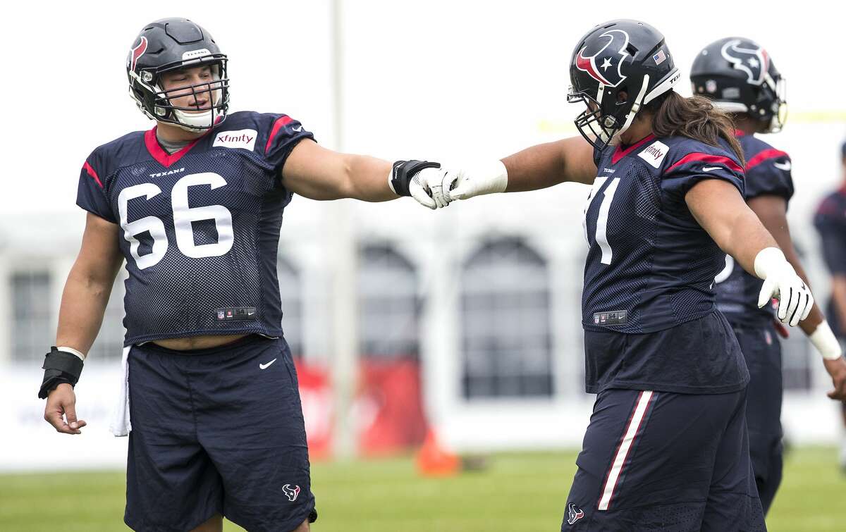 Houston Texans center Nick Martin (66) and guard Xavier Su'a-Filo (71) fist bump during training camp at The Greenbrier on Monday, Aug. 14, 2017, in White Sulphur Springs, W.Va. ( Brett Coomer / Houston Chronicle )