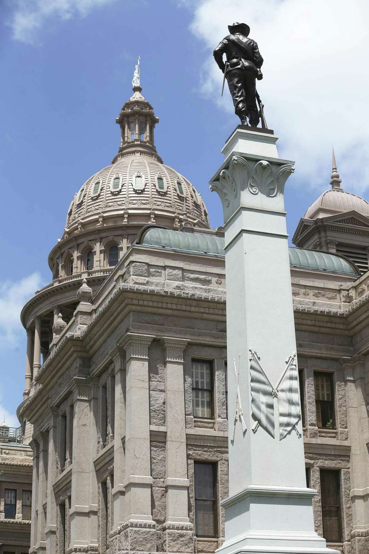 A depiction of Civil War flags adorns the side of the Texas Brigade monument on the east side of the State Capitol building in Austin on August 16, 2017.