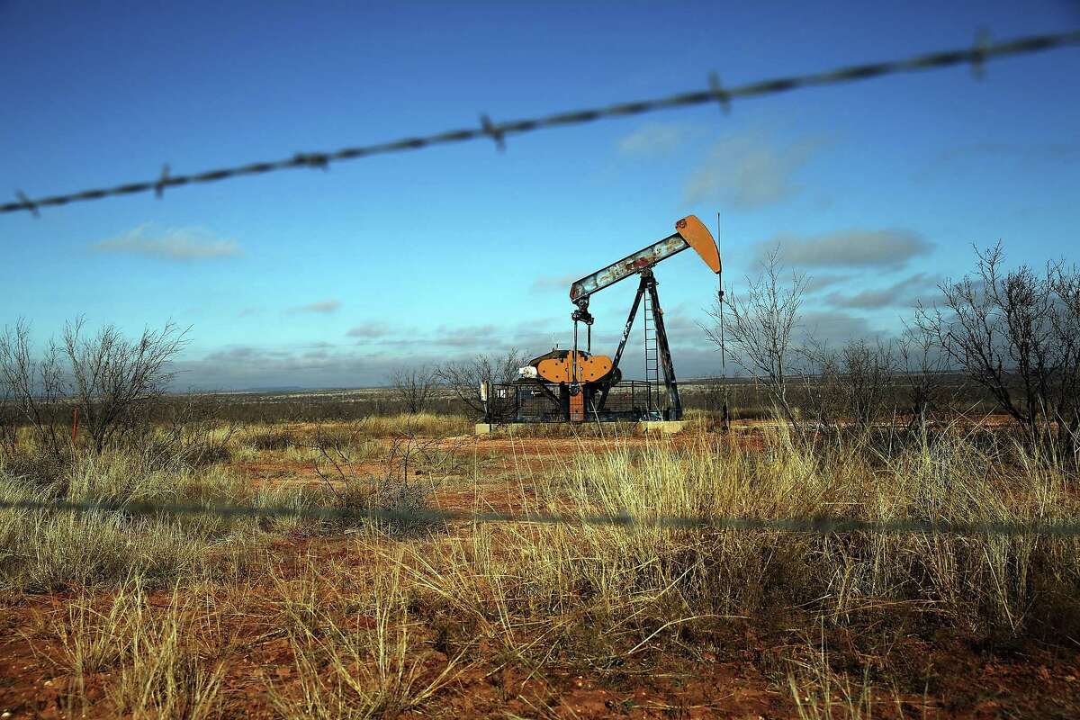 Oil is pumped near Big Springs. The pace of deals in the Permian Basin has slowed through a combination of low oil prices and the oil industry's buying spree in West Texas earlier this year.﻿