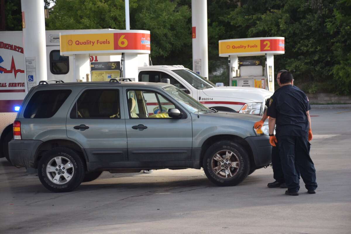 A man's body was discovered Friday morning in the driver's seat of an SUV parked at a North Side Shell station gas pump.