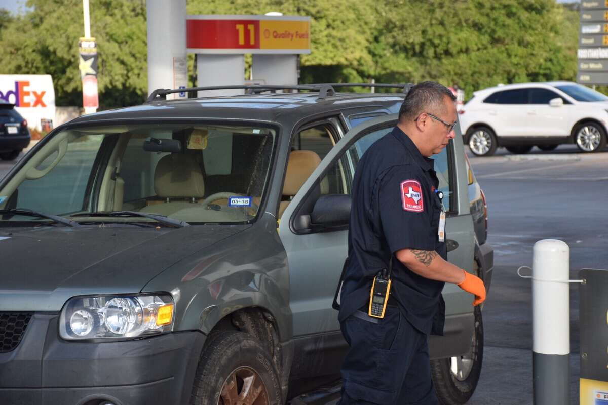 A man's body was discovered Friday morning in the driver's seat of an SUV parked at a North Side Shell station gas pump.