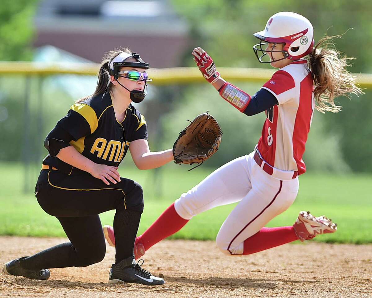 (Catherine Avalone - New Haven Register) Amity short stop Cassidy Kirby waits for the throw as Foran's Dani Kemp slides in at second, Wednesday afternoon, May 20, 2015, in Woodbridge. The Foran Lions defeated the Lady Spartans, 6-4.