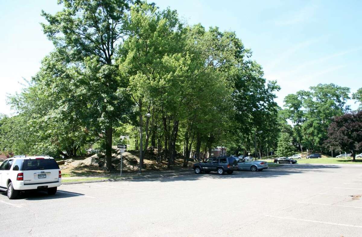 Some North Mianus School parents object to a parking plan that would expand this parking area in front of the school by eliminating the trees, shown Friday afternoon.