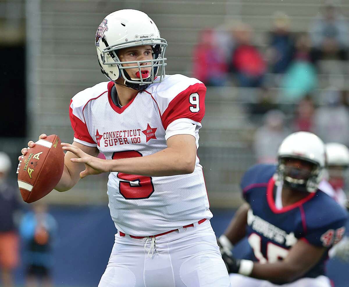 Constitution QB Brandon Bisack, of Fairfield Warde, gets ready to fire a pass in the CHSCA Super 100 Classic Football All-Star Football Game, against the Nutmeg All-Stars, Saturday afternoon, June 27, 2015, at Rentschler Field in East Hartford. Nutmeg won, 44-22. (Catherine Avalone/New Haven Register)