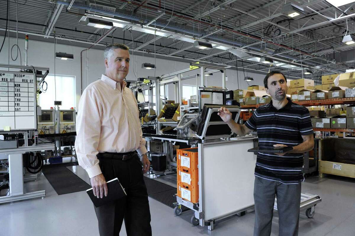 James Furlong, left, president of Belimo Americas and John Forlenzo, a vice president, give a tour of the Danbury facility, Wednesday, August 16, 2017.