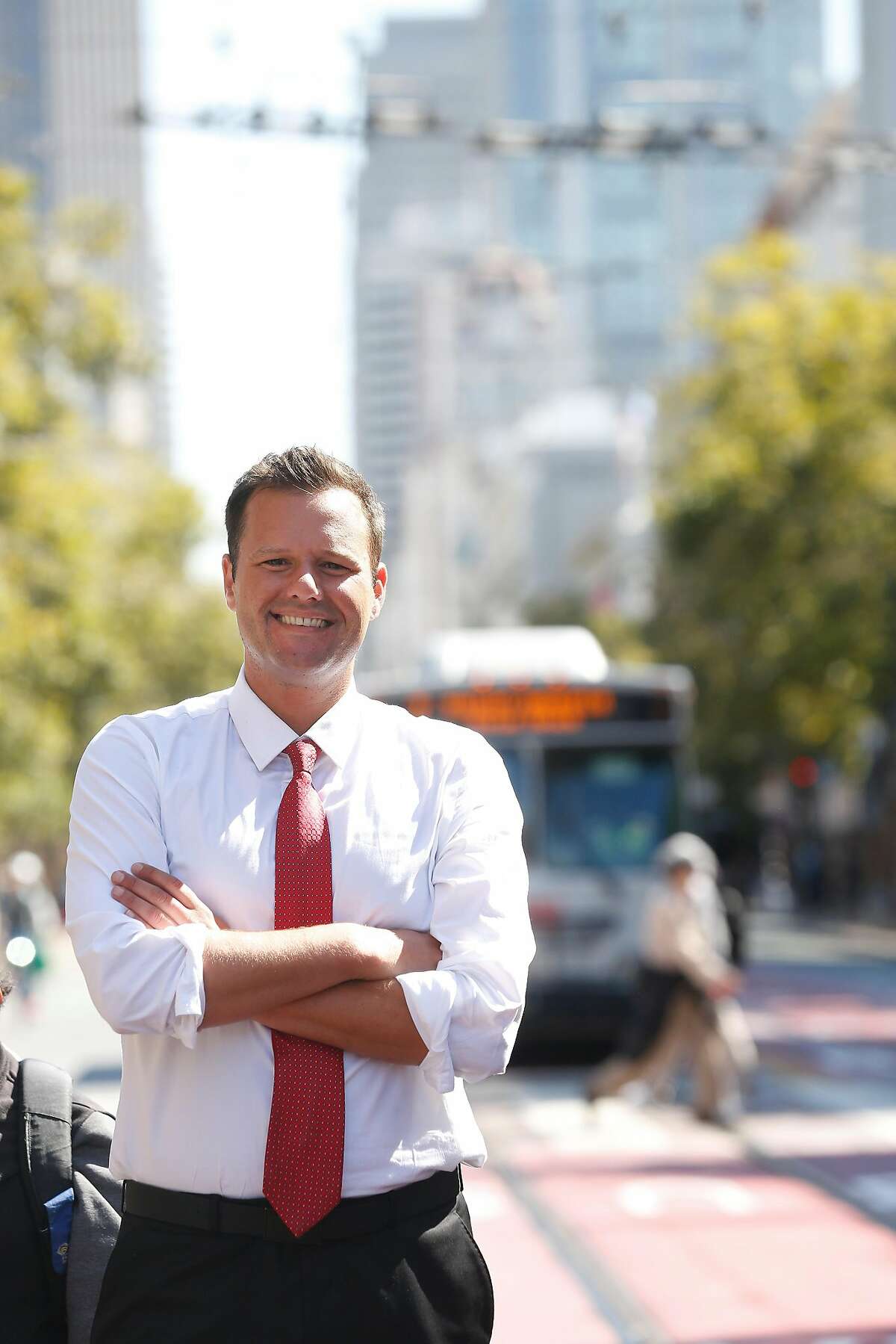 Matt Haney, San Francisco Board of Education commissioner and Dream Corps national policy director , stands on Market Street for a portrait on Monday, July 24, 2017 in San Francisco, Calif.
