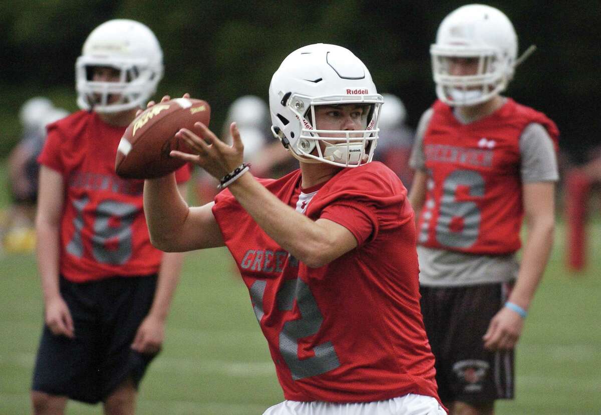 Greenwich Quarterback Gavin Muir passes to receivers during the first day of fall football practice on Friday, August 18, 2017 at Greenwich High School for the 2017 FCIAC season.