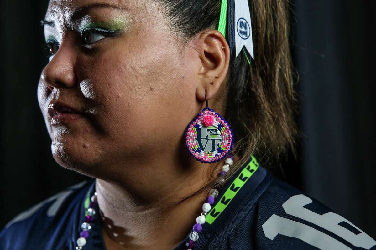 Adrienne Fulgencio poses for a portrait before a Seahawks game at CenturyLink Field, Aug. 18, 2017.