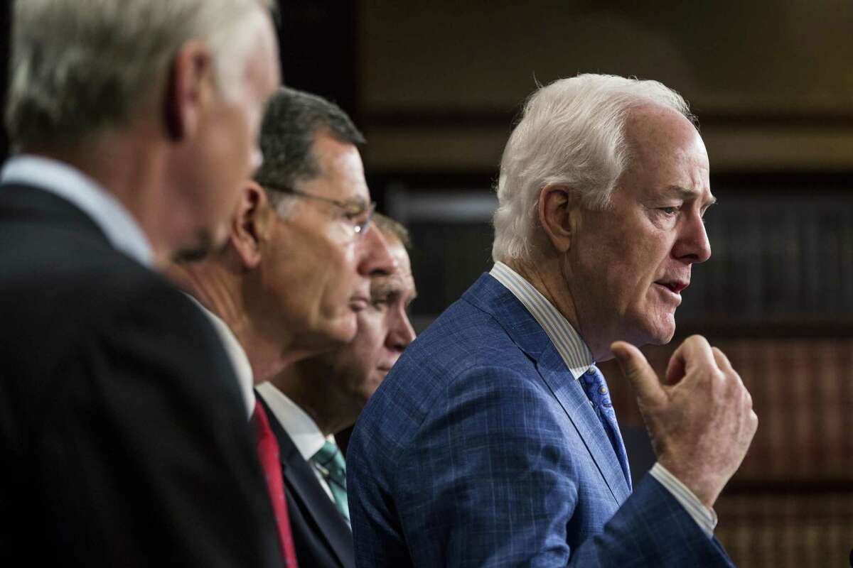 Senate Majority Whip John Cornyn, a Republican from Texas, speaks during a press conference in Washington, D.C., U.S., on Thursday, Aug. 3, 2017. Senate Republicans said they will make a major push in this fall's appropriations process to fund security enhancements along the U.S.-Mexico border, including a border wall. Photographer: Zach Gibson/Bloomberg