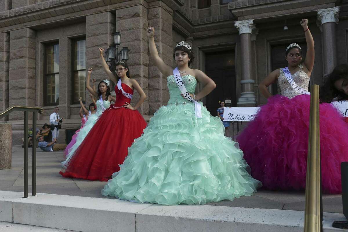 Dressed as a Quice?–eras, young women protest SB4 in front of the State Capitol, Wednesday, July 19, 2017. The bill known as the "show me your papers," bill will take effect on September 1st. The Quince?–era is the coming of age for a girl in the Hispanic culture.