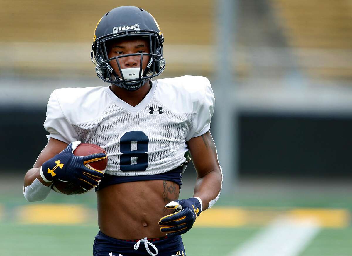 Wide receiver Demetris Robertson carries the ball during a Cal Bears football practice and scrimmage in Memorial Stadium at UC Berkeley on Saturday, Aug. 19, 2017.