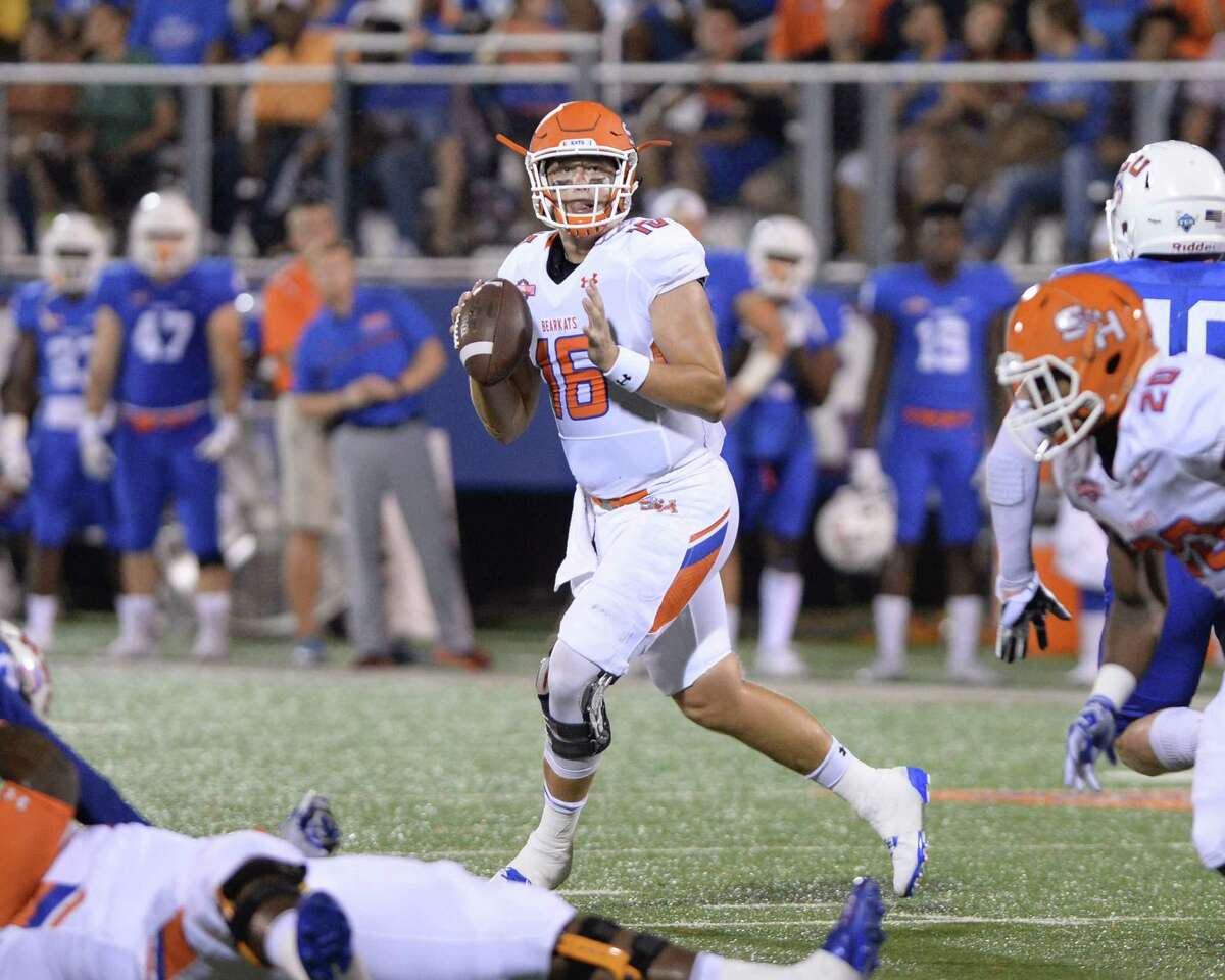 Quarterback Jeremiah Briscoe (20) of Sam Houston State looks for an open receiver in the second quarter of a Southland Conference football game between the Houston Baptist University Huskies and the Sam Houston State University Bearkats on September 24, 2016 at Husky Stadium, Houston, TX.