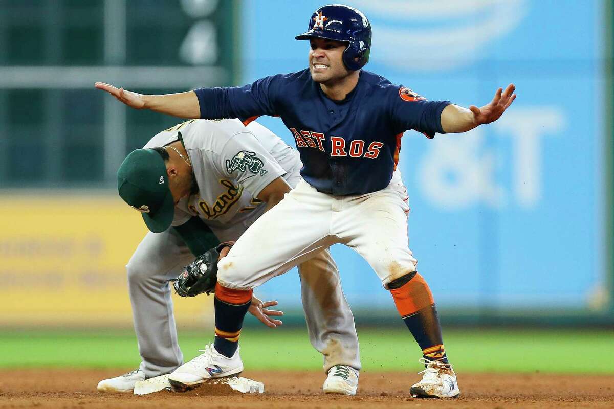 George Springer of the Houston Astros steals second base in the